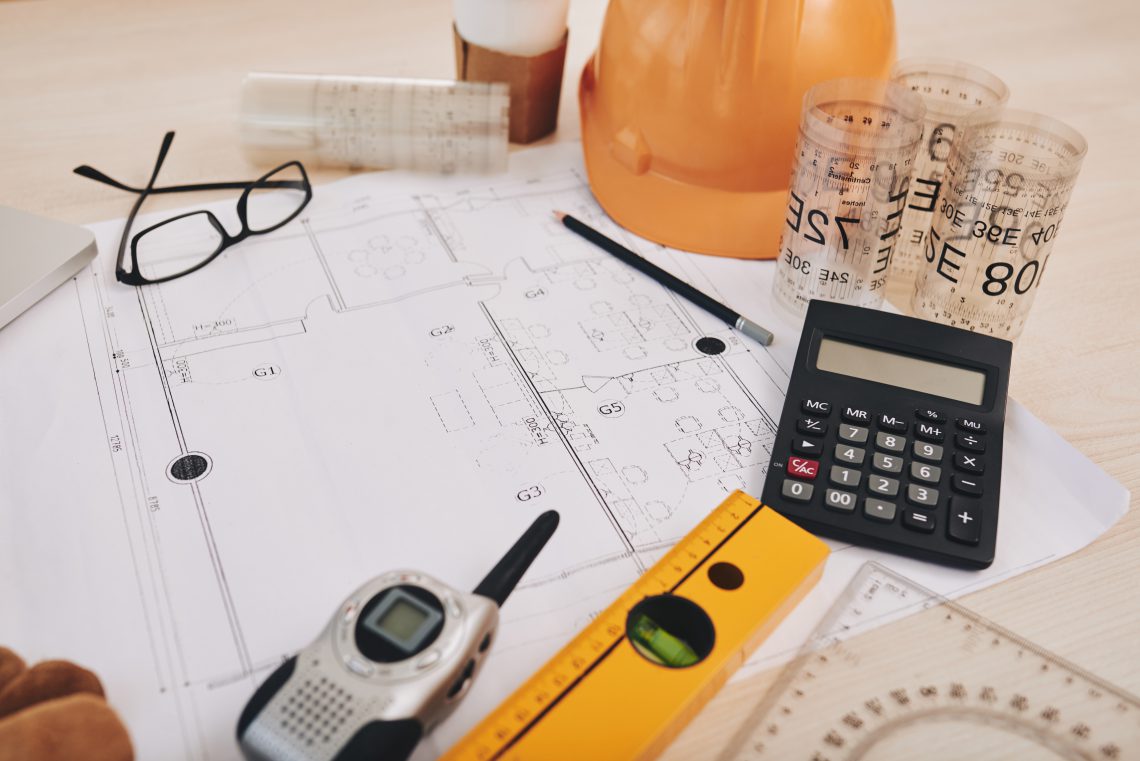 Table with everything for drawing a construction plan