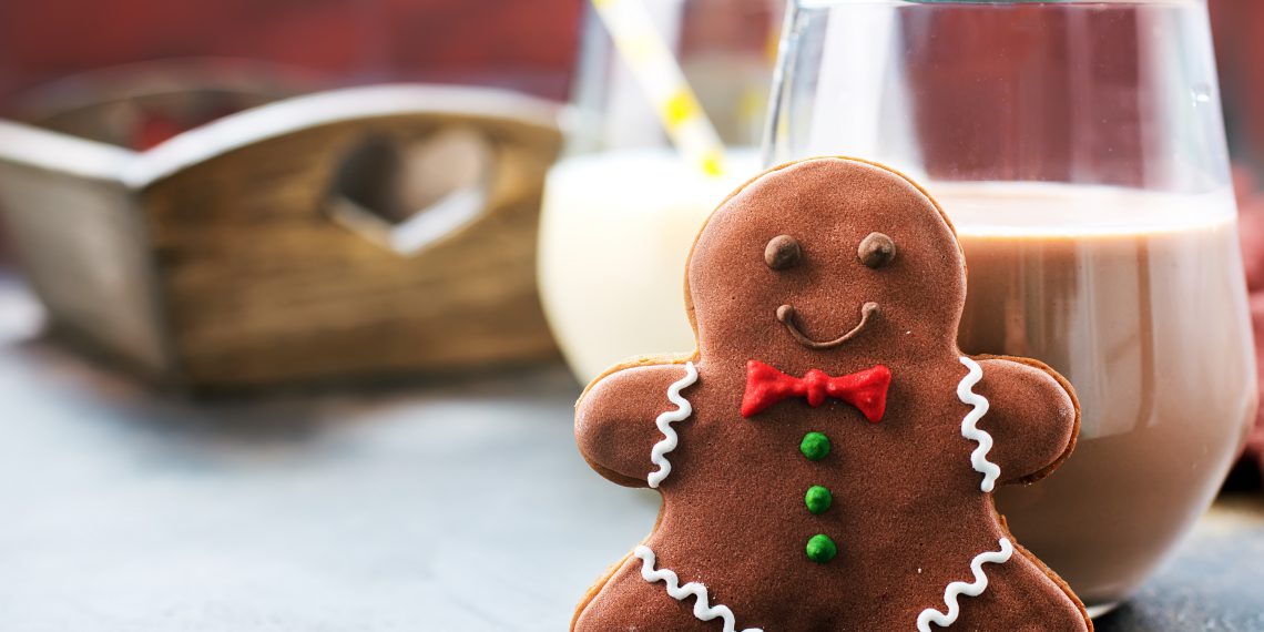 cookies and milk on a table, chocolate milk with ginger cookies