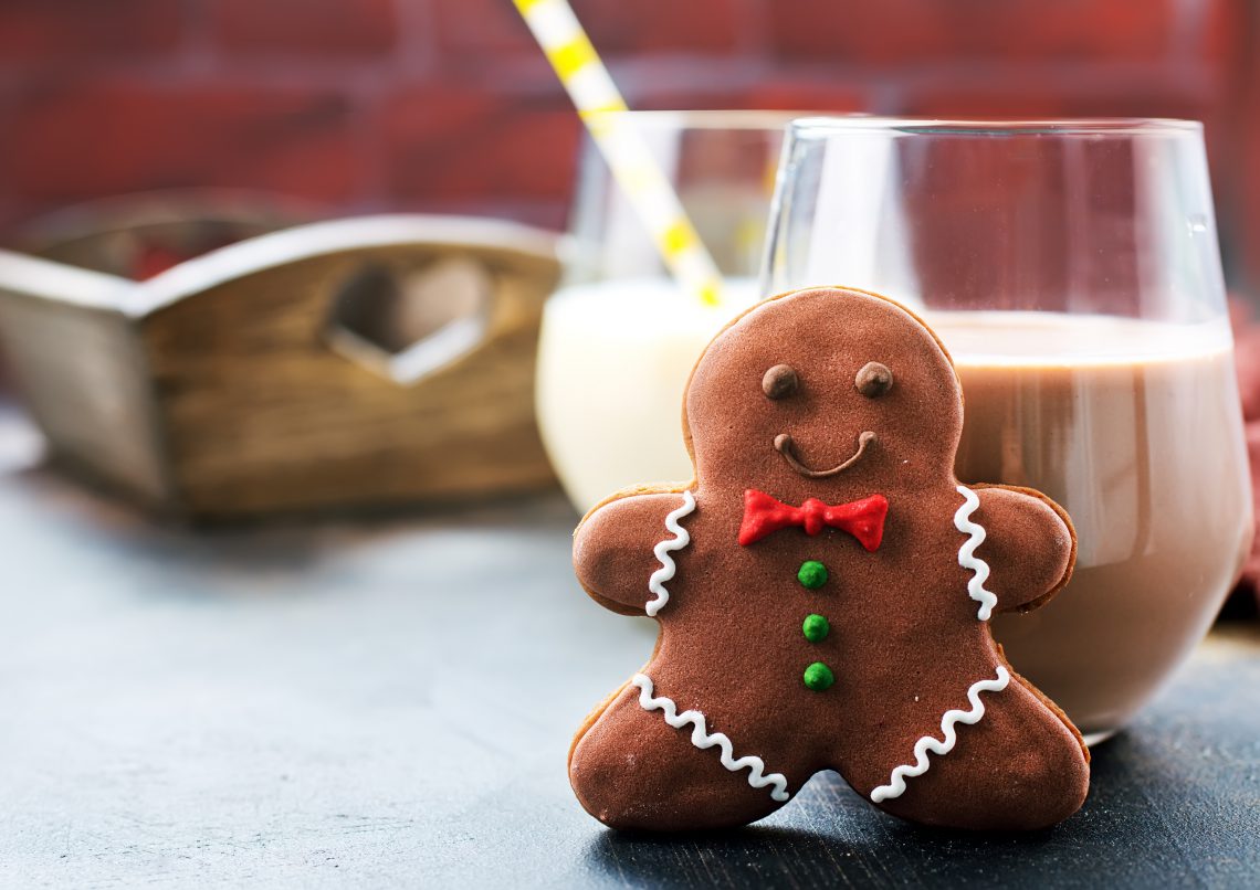 cookies and milk on a table, chocolate milk with ginger cookies