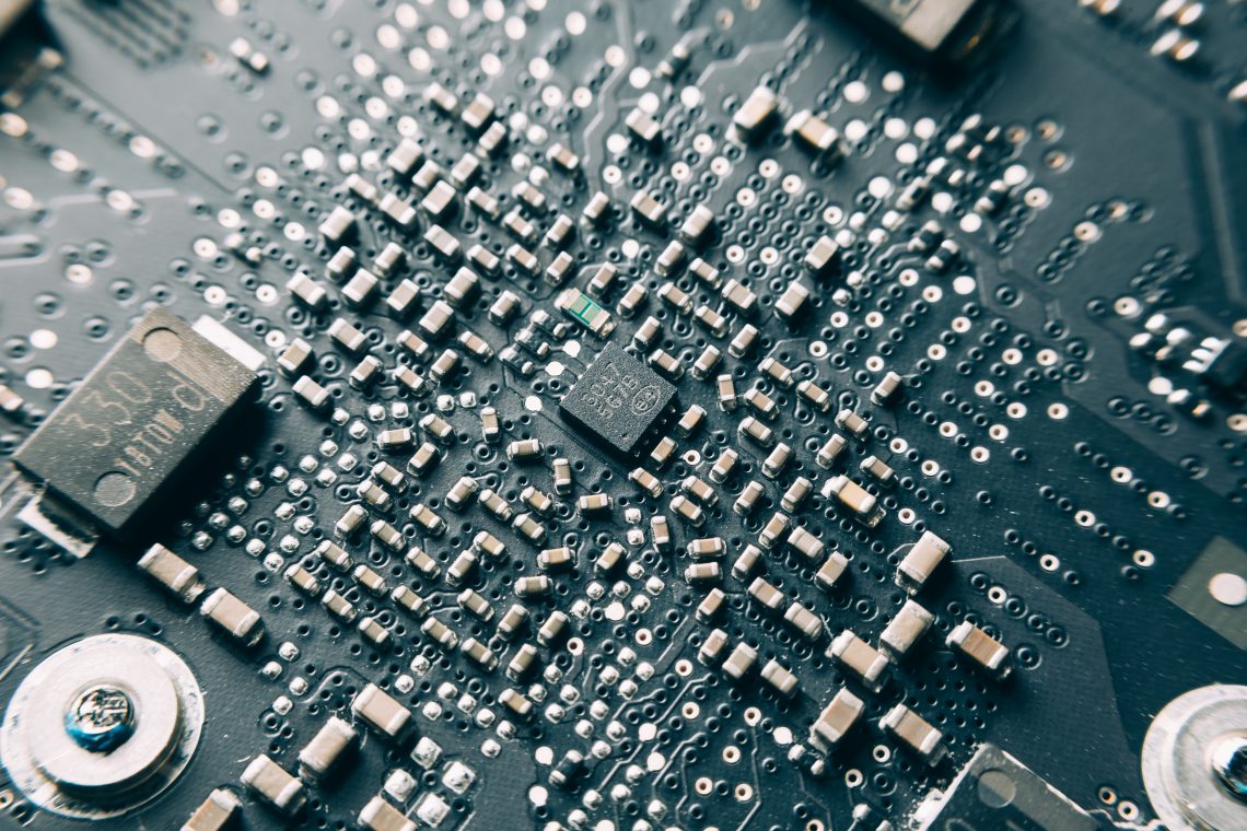 Close-up Shot of Printed Circuit Board with many electrical components.