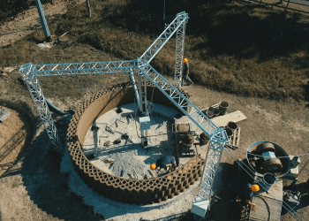 Overhead view of GAIA construction site with a delta style construction 3D printer. Photo curtesy of WASP.