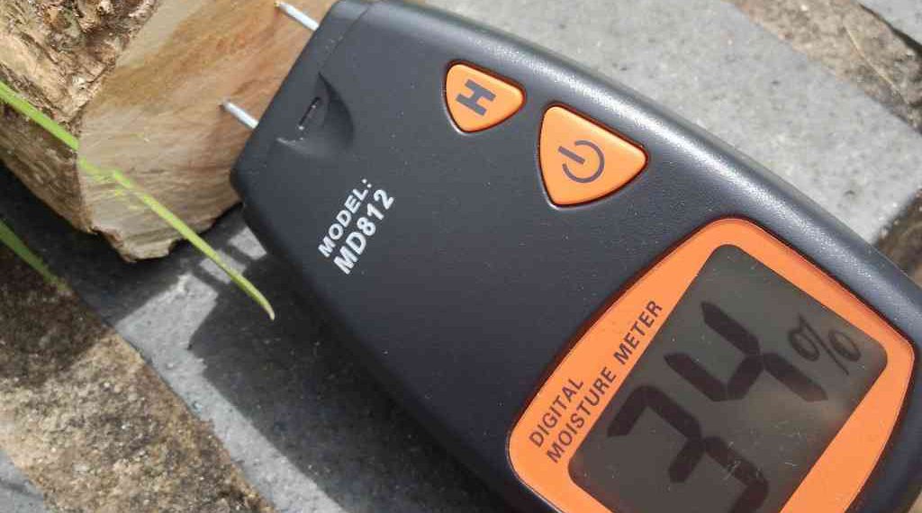 Measuring wood moisture content with a moisture meter. Photo credit: Roo Reynolds