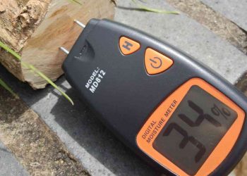 Measuring wood moisture content with a moisture meter. Photo credit: Roo Reynolds