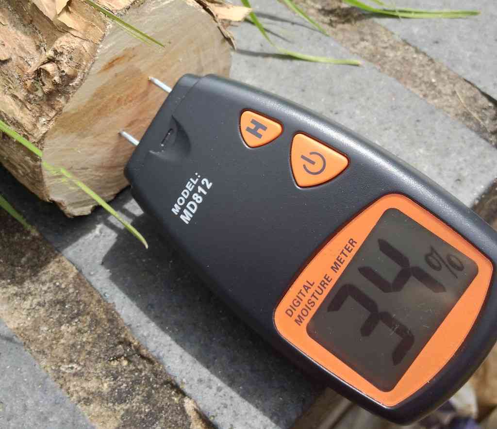 Measuring wood moisture content with a moisture meter. Photo credit: Roo Reynolds