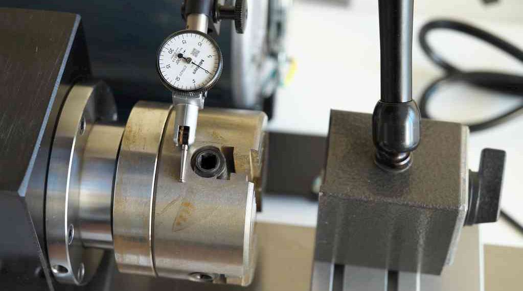 Setting up a dial test indicator for measuring runout on lathe. Photo credit: John L.