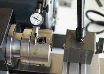 Setting up a dial test indicator for measuring runout on lathe. Photo credit: John L.